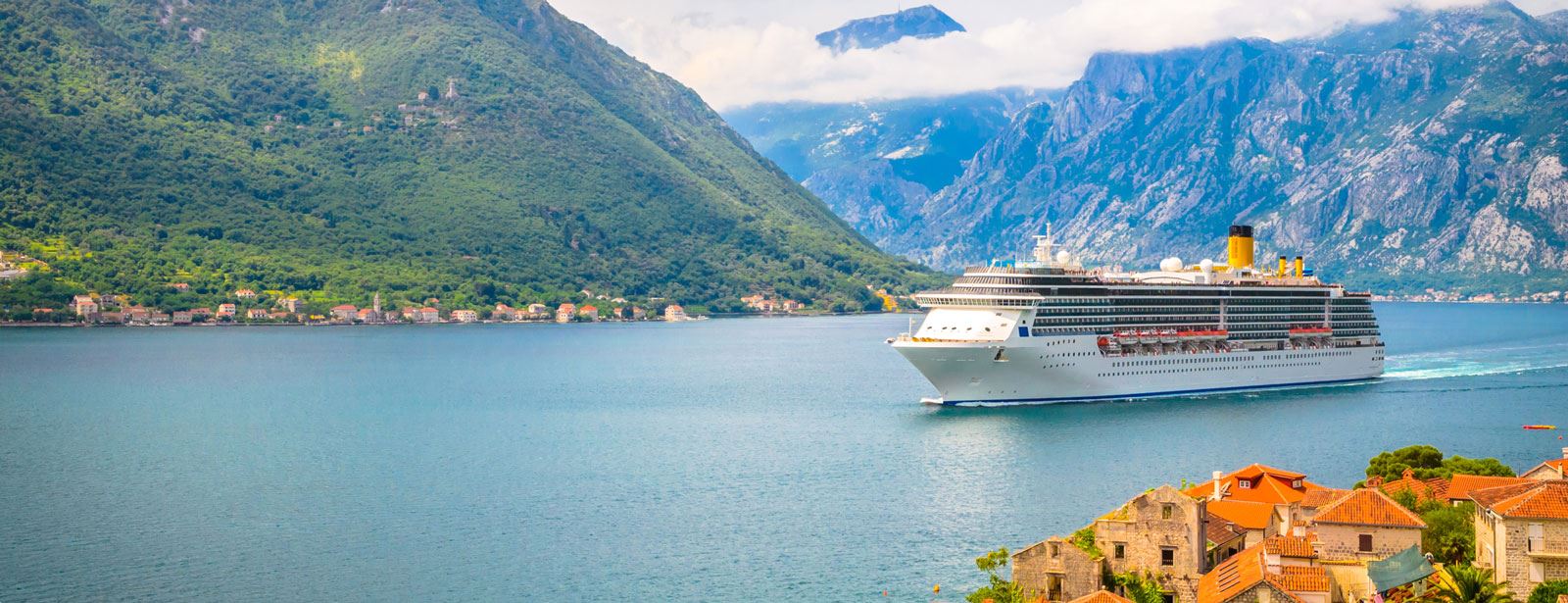 Cruise ship sailing through the Mediterranean shore